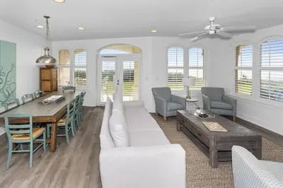 a living room with a couch and a table at Monterey B-102 in Seacrest
