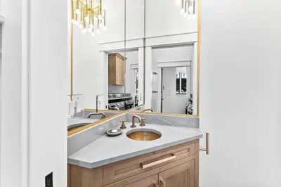 a bathroom with a sink and a mirror at Abba Cottage in Rosemary Beach