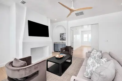 a living room with a couch and a tv at Del mar 30A in Seacrest