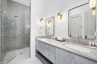 a bathroom with two sinks and a shower at Del mar 30A in Seacrest