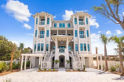 a large white house with stairs up to it at Del mar 30A in Seacrest