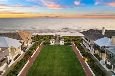 an aerial view of a house with the ocean at Abba Cottage & Carriage House in Rosemary Beach