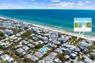 an aerial view of a city with a sign and the ocean at Abba Cottage & Carriage House in Rosemary Beach