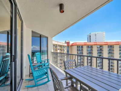 a balcony with a table and chairs on a balcony at Summerhouse 1012C in Panama City Beach