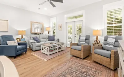 a living room with couches and chairs and a table at 17 Trigger Trail West in Panama City