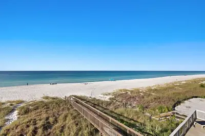 a view of a beach with a boardwalk and the ocean at Blessing on the Beach in Panama City Beach