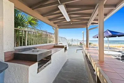 a bathroom with a sink on a deck with the beach at Latitude 29 Unit 21 in Panama City Beach