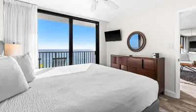 a bedroom with a large bed and a large window at One Seagrove Place 0601 in Santa Rosa Beach