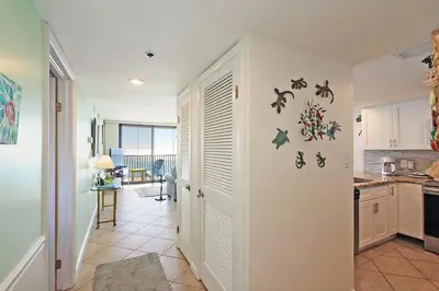 a kitchen with a door with animals on the wall at One Seagrove Place 0605 in Santa Rosa Beach