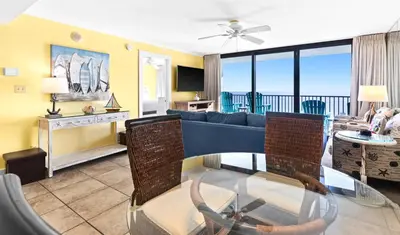 a living room with a couch and a table at One Seagrove Place 1101 in Santa Rosa Beach