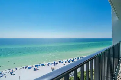 a view of a beach with umbrellas and the ocean at One Seagrove Place 1101 in Santa Rosa Beach
