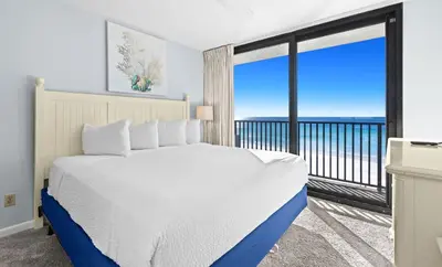 a bedroom with a bed and a large window at One Seagrove Place 0501 in Santa Rosa Beach