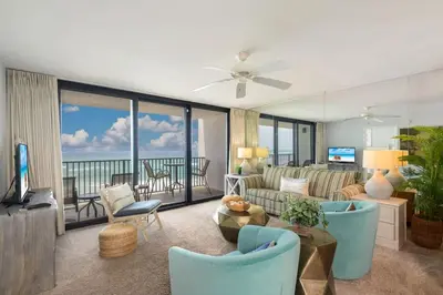a living room with a couch and chairs at One Seagrove Place 0501 in Santa Rosa Beach