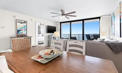 a living room with a table with a bowl on it at One Seagrove Place 0802 in Santa Rosa Beach