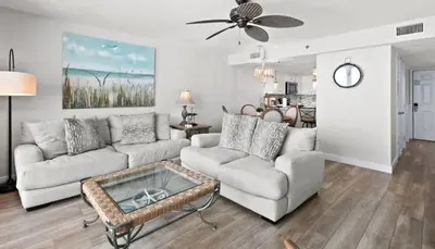 a living room with a couch and a coffee table at One Seagrove Place 0704 in Santa Rosa Beach