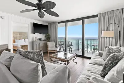 a living room with a couch and a view of the ocean at One Seagrove Place 0704 in Santa Rosa Beach
