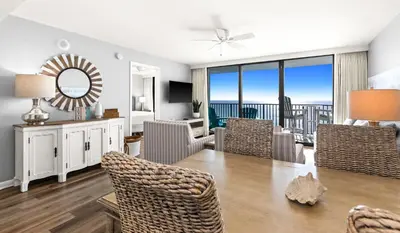 a living room with a table and chairs with a view at One Seagrove Place 0807 in Santa Rosa Beach