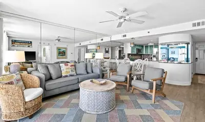 a living room with a couch and chairs and a table at One Seagrove Place 1407 in Santa Rosa Beach