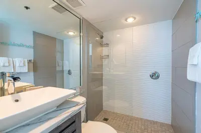 a bathroom with a shower and a toilet and a sink at One Seagrove Place 1503 in Santa Rosa Beach