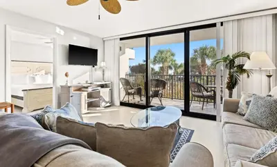 a living room with a couch and a table at One Seagrove Place 0107 in Santa Rosa Beach