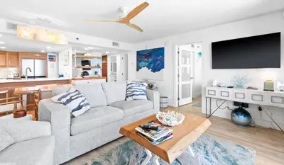 a living room with a couch and a table at One Seagrove Place 1106 in Santa Rosa Beach