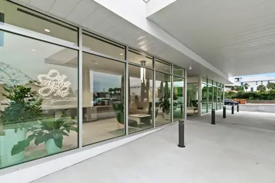 a large glass building with a lot of windows at One Seagrove Place 1507 in Santa Rosa Beach