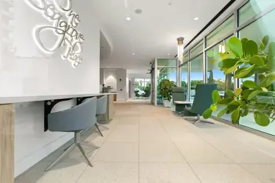 an office with chairs and tables and windows at One Seagrove Place 0403 in Santa Rosa Beach