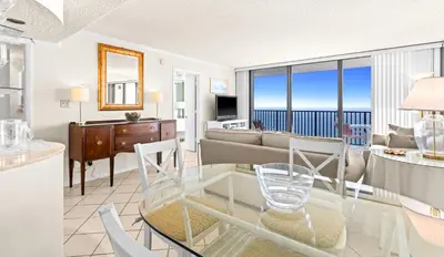 a living room with a view of the ocean at One Seagrove Place 1906 in Santa Rosa Beach