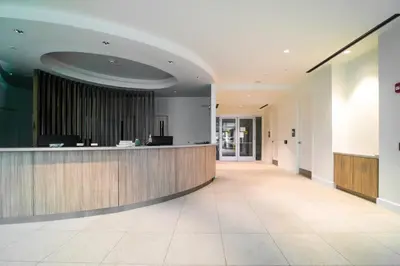 a lobby with a reception desk in a building at One Seagrove Place 1906 in Santa Rosa Beach