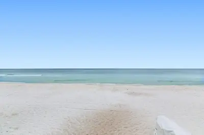a sandy beach with the ocean in the background at One Seagrove Place 1706 in Santa Rosa Beach