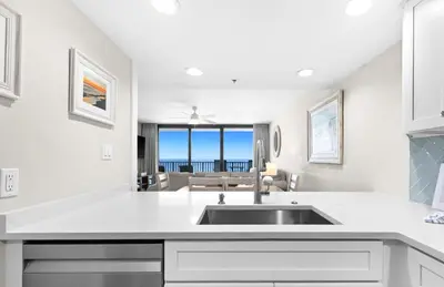 a kitchen with a sink and a view of the ocean at One Seagrove Place 1201 in Santa Rosa Beach