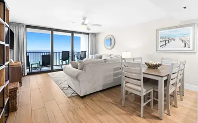 a living room with a couch and a table at One Seagrove Place 1201 in Santa Rosa Beach