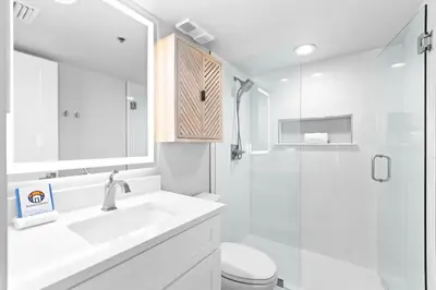 a bathroom with a sink and a toilet and a shower at One Seagrove Place 1008 in Santa Rosa Beach