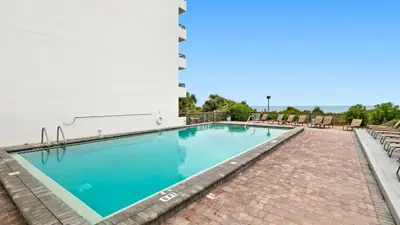 a swimming pool on the side of a building at One Seagrove Place 0207 in Santa Rosa Beach