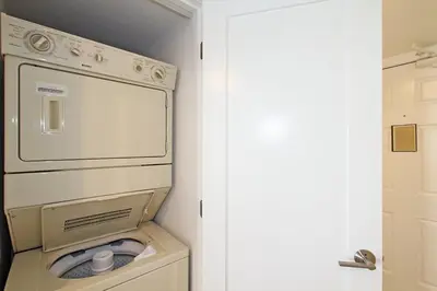 a washer and dryer in a small room at One Seagrove Place 0208 in Santa Rosa Beach
