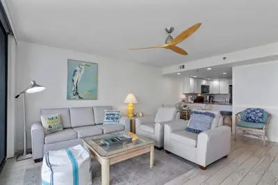 a living room with a couch and a table at One Seagrove Place 0208 in Santa Rosa Beach