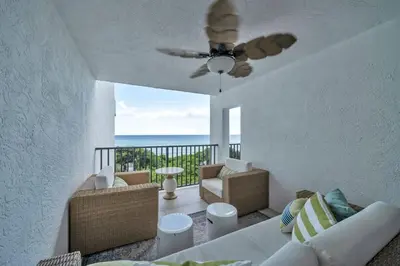 a living room with a couch and a ceiling fan at One Seagrove Place 0305 in Santa Rosa Beach