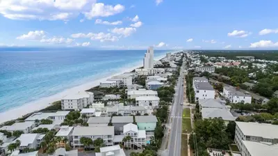 an aerial view of the beach and buildings at SunDune on 30A in Santa Rosa Beach