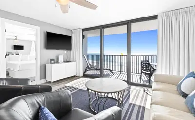 a living room with a couch and a view of the ocean at One Seagrove Place 0402 in Santa Rosa Beach