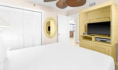 a bedroom with a bed and a flat screen tv at One Seagrove Place 1703 in Santa Rosa Beach