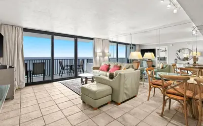a living room with a view of the ocean at One Seagrove Place 1806 in Santa Rosa Beach