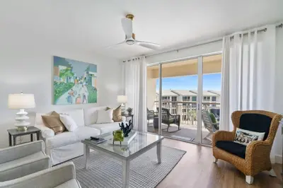 a living room with a couch and a table at High Pointe Resort 432 in Inlet Beach