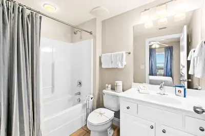 a bathroom with a sink and a toilet and a shower at Palazzo 0507 in Panama City Beach