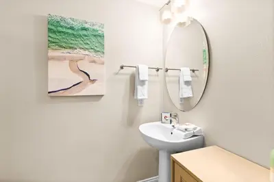 a bathroom with a sink and a mirror at Palazzo 0507 in Panama City Beach