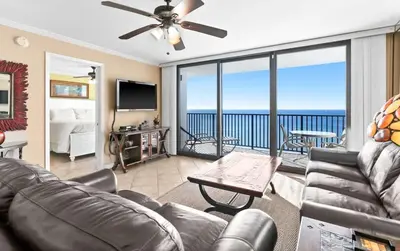 a living room with a couch and a view of the ocean at One Seagrove Place 1606 in Santa Rosa Beach