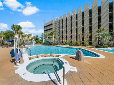 a swimming pool in front of a building at Emerald Beach #1333 in Panama City Beach