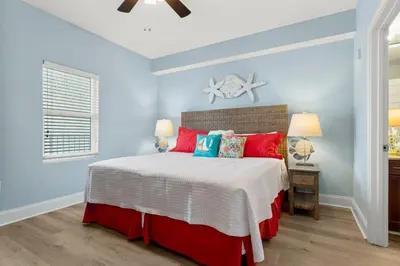 a bedroom with a bed and a starfish on the wall at Laketown Wharf #1433 in Panama City Beach