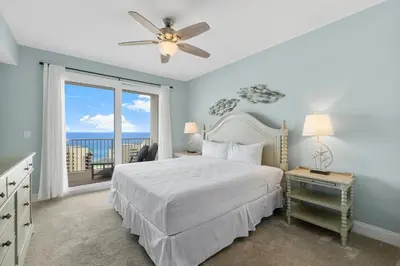 a bedroom with a bed and a large window at Laketown Wharf #1510 in Panama City Beach