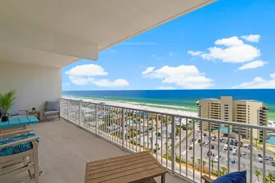 a balcony with a view of the beach and the ocean at Laketown Wharf #1510 in Panama City Beach