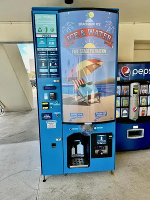a vending machine with a sign that says ice and water at Newly Completely Renovated Beach Condo at Sunbird Resort! Free Beach Chair and Umbrella Service! by Dolce Vita Getaways! in Panama City Beach